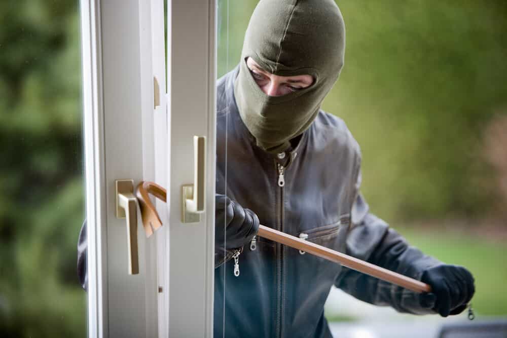 Ski Masked Man Breaking into Property with a Crowbar