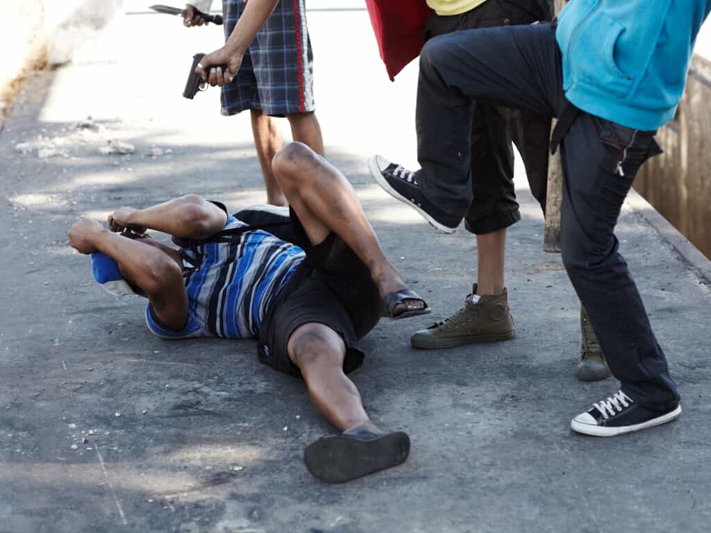 An Individual Getting Beat Up By Multiple People